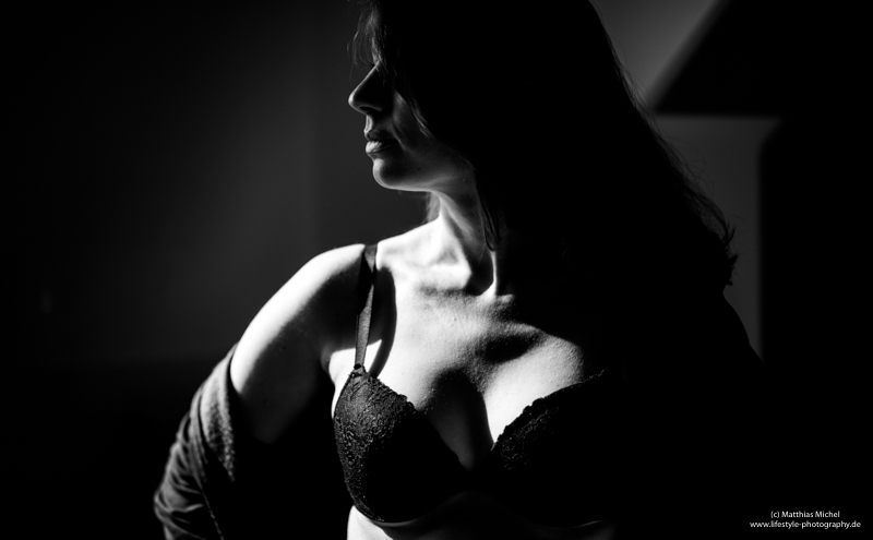 Girl in a bra enjoying the morning sun