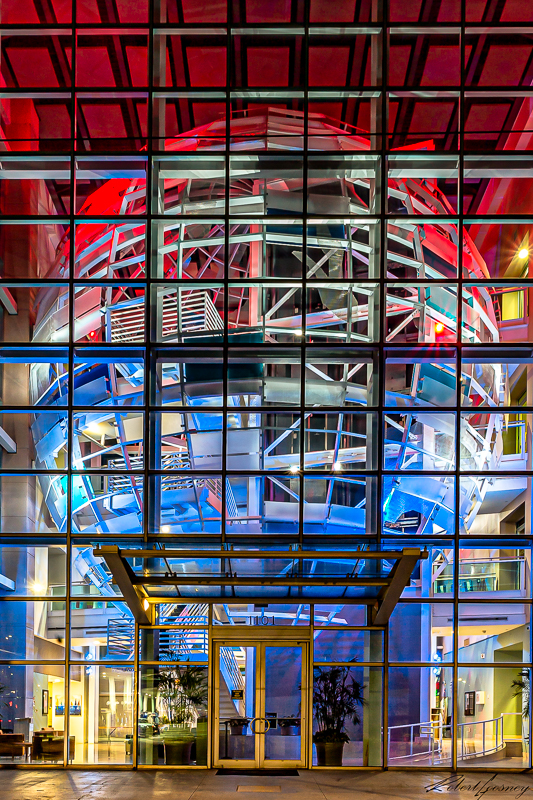 Steel Globe in a Glass Lobby