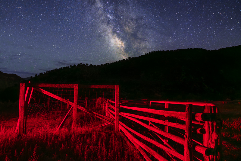 Milky Way galaxy and old wooden fence